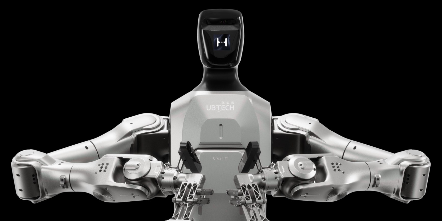 A Humandroid UBTECH Cruzr Y1 industrial humanoid, arms fully extended, lit against black.